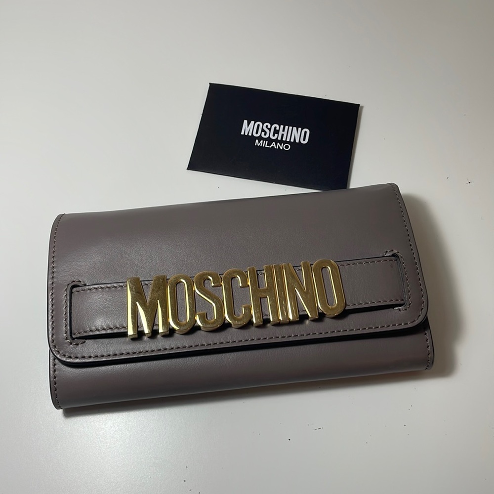AUTHENTIC MOSCHINO WALLET/clutch used like new pristine condition gray/gold